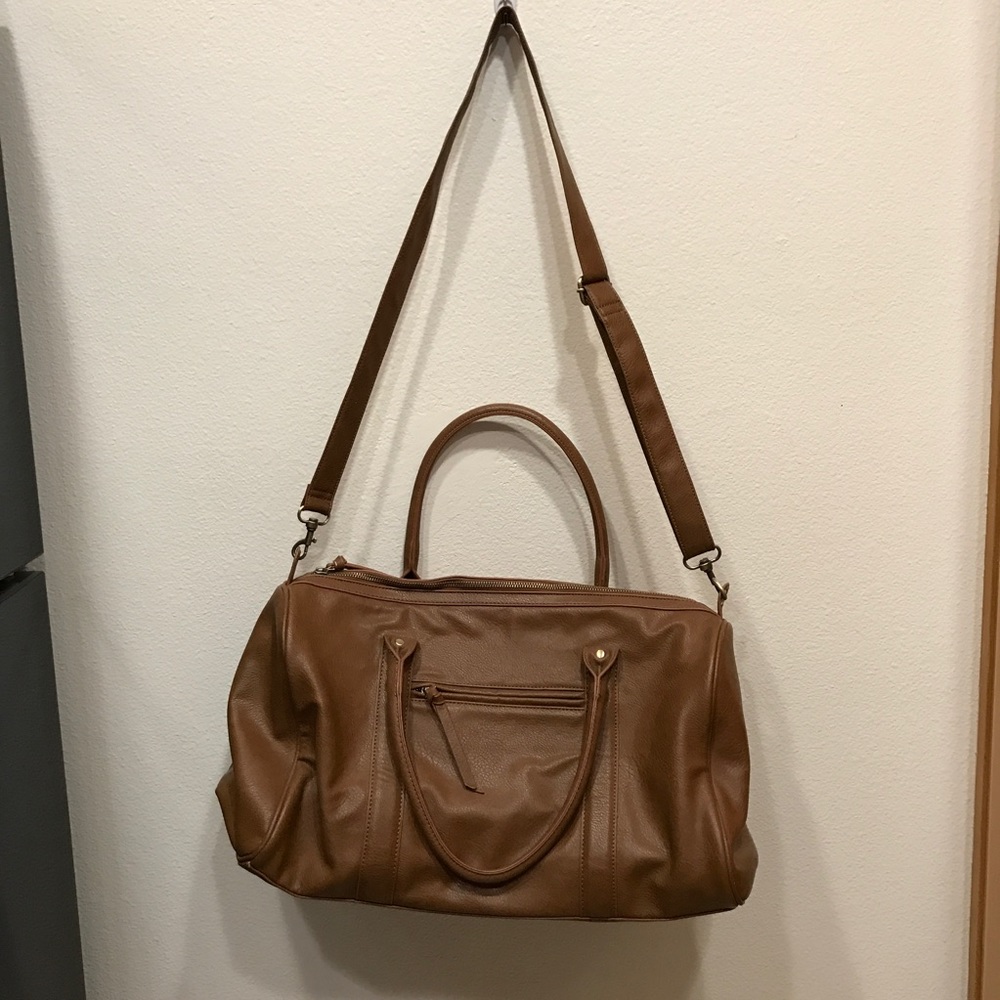 Faux leather duffle bag with cross-body strap